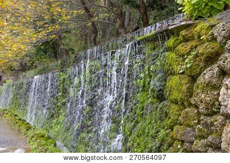 View Of The Artificial Cascades Of A Mountain Stream Flowing Down Over Moss-covered Stones. Greece