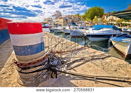 Mooring Bollard And Old Boats In Kastela Harbor, Split Region Of Croatia
