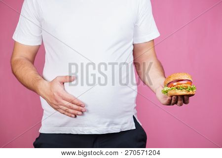 Glutton Man Eating Tasty Burger. Imbalanced Ration, Snacking With Fast Food, Unhealthy Diet