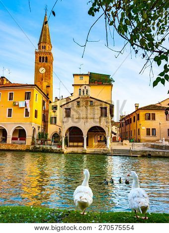 Vertical View Of Lemene River, Clock Tower And Oratorio Madonna Della Pescheria, Portogruaro, Veneto