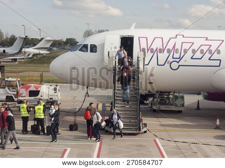 Luton/england - October 11, 2018: Passengers Leaving Wizzair Airplane After Flight To Luton Airport.