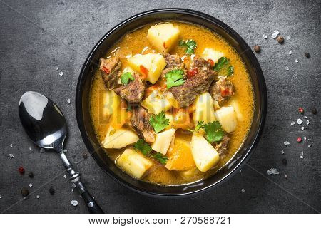 Beef Stew With Vegetables - Carrot, Ppototo And Pumpkin On Black Background.  Top View With Copy Spa
