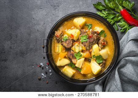 Beef Stew With Vegetables - Carrot, Ppototo And Pumpkin On Black Background.  Top View With Copy Spa