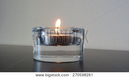Close-up To A Small Candle Peaceful Light