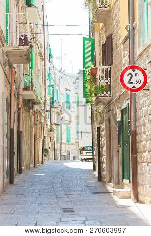Molfetta, Apulia, Italy - Walking Through An Old Alleyway In Molfetta