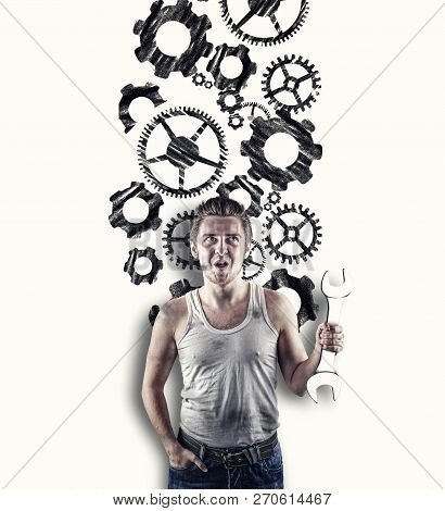 Excited Mechanic In Standing In Front Of A White Wall Drawn With Engine Gear Wheels.