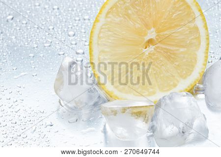 Lemon Ring With Ice On A Silvery Background Closeup