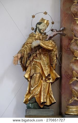 RETZBACH, GERMANY - JULY 04, 2018: Saint John Nepomuk statue on the Holy Family altar in Maria im Grunen Tal pilgrimage church in Retzbach in the Bavarian district of Main-Spessart, Germany