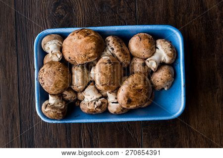 Portobello Raw Cremini Mushrooms In Plastic Container Package Or Box.
