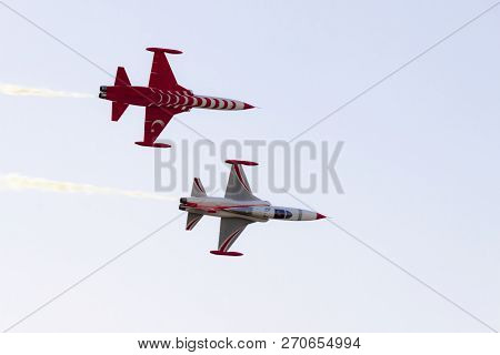 Two Airplanes Of The Turkish Acrobatic Aviation Squadron Are Performing Acrobacy In The Sky, Commemo