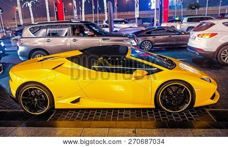 Dubai, Uae - December 23, 2017: Luxury Supercar Lamborghini Huricane Yellow Color Parked Next To Dub