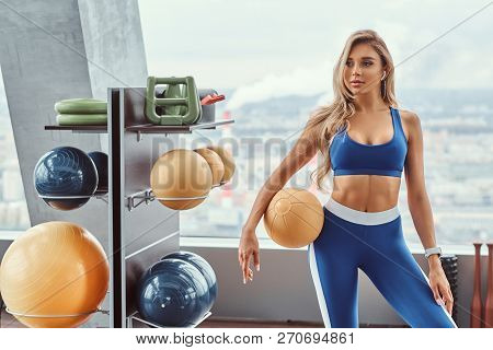 Sexy Girl With A Fitness Ball In The Gym.