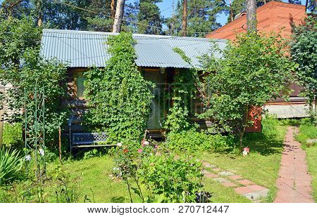 Small Summer Country House In The Shade Of Garden Trees