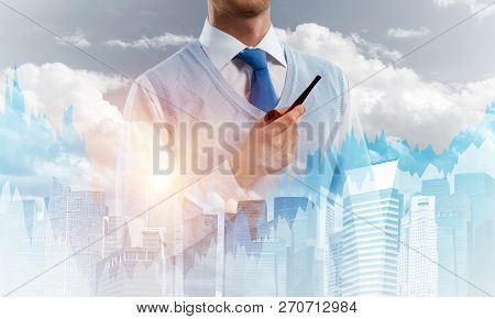 Double Exposure Of Confident And Young Businessman In Smart-casual Wear Smoking Pipe And Modern City