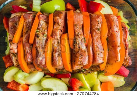Raw Pork Fillet Marinated With Pepper, Salt, Fresh Parsley, Honey, Paprika, Cumin. Meat,  Persimmon,