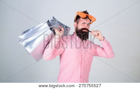 Happy Shopping With Bunch Paper Bags. Shopping Addicted Consumer. Man Bearded Hipster Wear Sunglasse