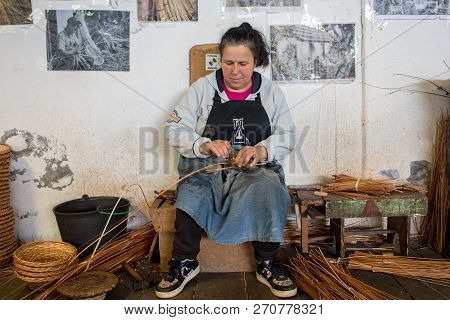 Camacha, Madeira, Portugal - April 19, 2018: A Basket Weaver At Work In The Factory Shop In Camacha 