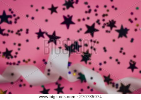 Blurred Festive Backkdrop With Satin Ribbon And Stars