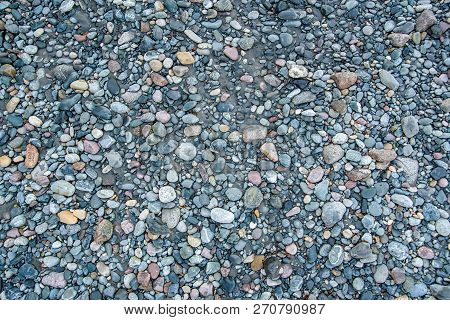 Colorful Pebbels On Mountain River Bank Close