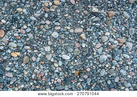 Colorful Pebbels On Mountain River Bank Close