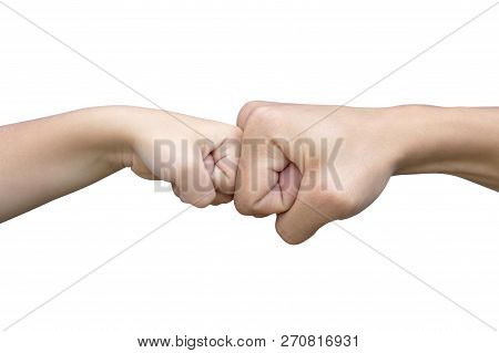 Power Five, Fist Bump Or Brofist. Close-up Of Child And Father Fists Touching Each Other