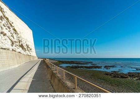 Saltdean Beach Seafront And White Sandstone Chalk Cliffs With Walkway For People Exercise. Underclif