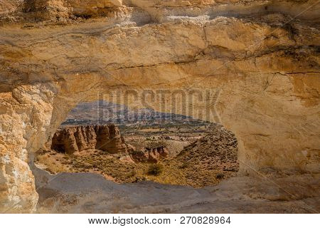 Unusual Rock On A Hill With A Hole. Beautiful Landscape In Sunny Autumn Weather. Cappadocia, Turkey