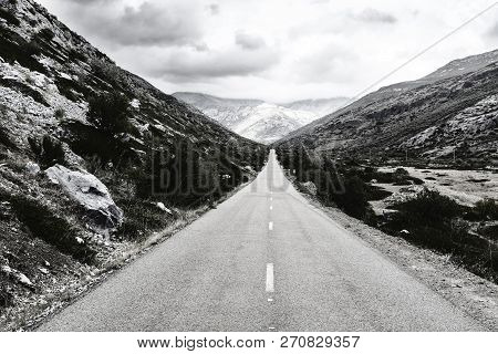 Stright Asphalt Road Of Europe Peaks In Spain On A Rainy Day