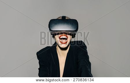 Happy Woman With Virtual Reality Headset Or 3d Glasses. Excited Woman Using Modern Vr Headset And Ex