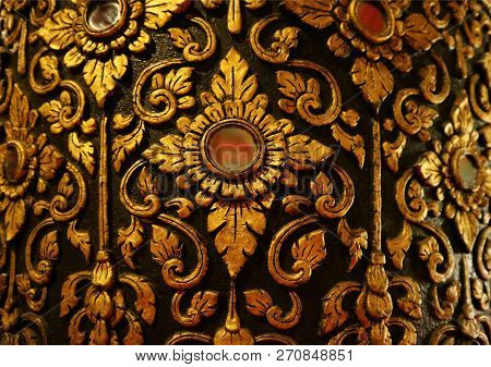 Gorgeous Gold And Black Vintage Thai Pattern On The Teak Lacquered Pillar In Wat Phumin Temple, Nan 