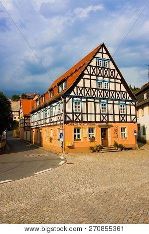 Hohnstein, Germany - 04.08.18.town With Hohnstein Castle And Neat Timber Framing Houses In Saxon Swi