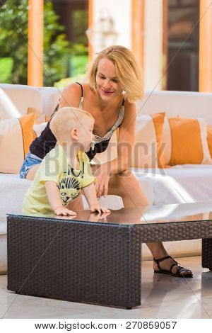 Woman Playing With Her Baby Outside. The Concept Of A Happy Full-fledged Family Life. Games With A C