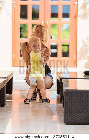 Woman Playing With Her Baby Outside. The Concept Of A Happy Full-fledged Family Life. Games With A C