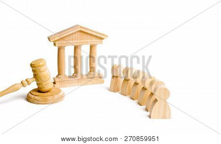 People Standing Near The House Of Government And Judge's Gavel. Concept Of The Judicial System And T