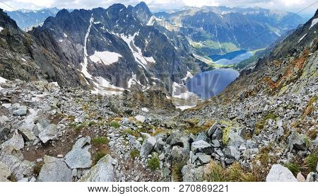 Morskie Oko. High Tatras, Poland, May 27, 2018. Beautiful landscape of snowy mountain tops and the lake between them. View from the mountain Rysy.