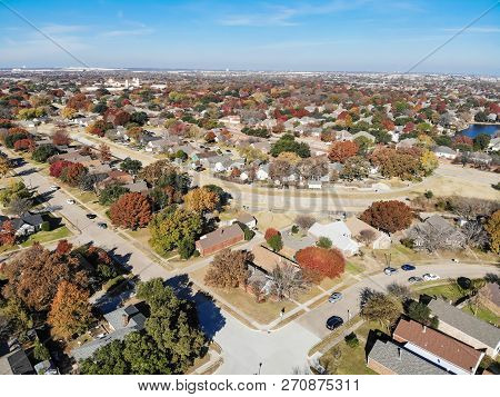 Top View Residential Neighborhood With Lake, Pond And Colorful Fall Foliage In Texas, America