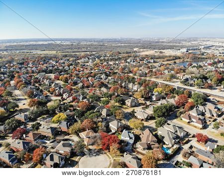 Aerial View Residential Neighborhood With Highway Stack Interchange In Fall Season In Texas