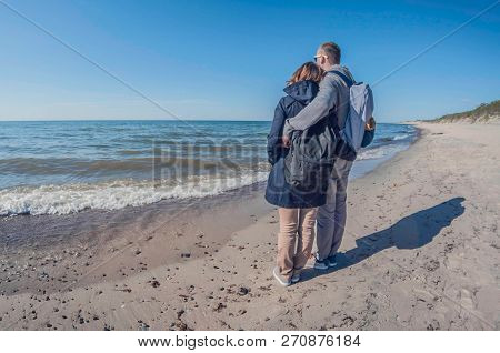 Love Couple Watching Sea In Winter Sunny Day