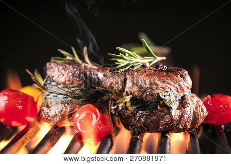 Fresh Fillet Steak On Grill With Flammes.