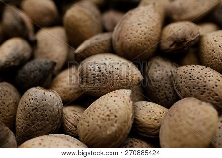 Almonds Texture And Background For Design. Close Up View Of Shelled Almonds. Heap Of Almonds. Organi