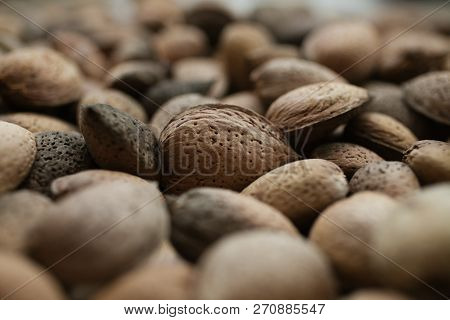 Almonds Texture And Background For Design. Close Up View Of Shelled Almonds. Heap Of Almonds. Organi
