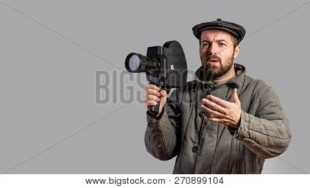 Emotional Cameraman With Retro Camera In His Hands, Studio Shot. Old-fashioned Clothing Style. Comic