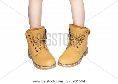 Child's Legs In Yellow Shoes Isolated On White Background, Like Humor Positive Emotions
