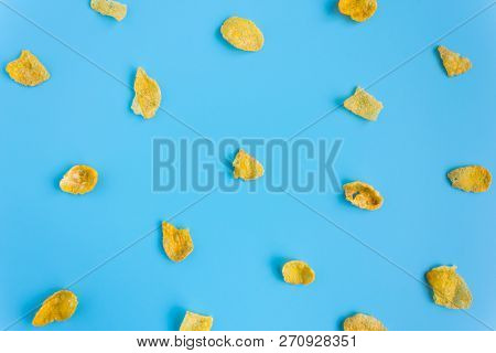 Cornflakes On Blue Pastel Background Minimalist. Cereal Breakfast Healthy Clean Food For Food And De