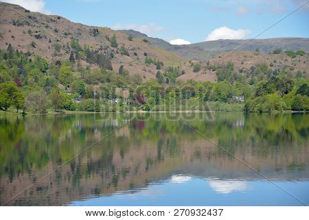 Mountains And Fields Reflected In The Waters Of Grasmere