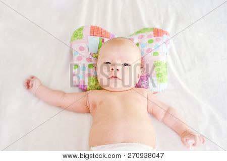 Newborn Baby Boy On The Orthopedic Pillow
