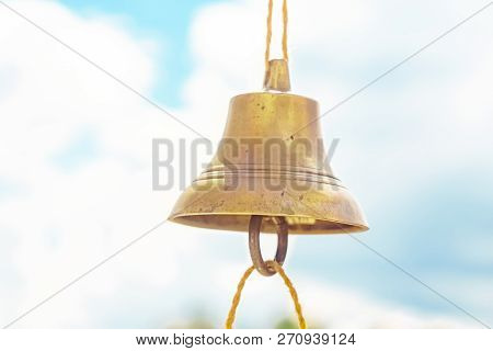 The Bell Hangs On A Rope Against The Sky