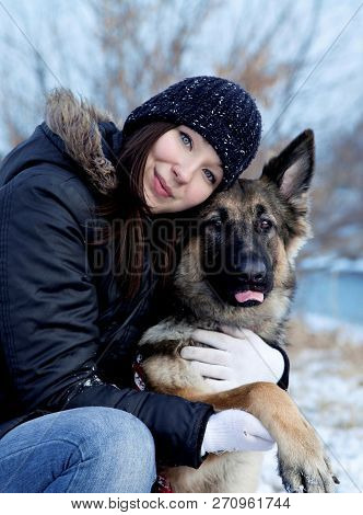 The German Shepherd Dog With Young Girl. Lovely Portrait.the Cute Portrait Of The Best Friends. The 