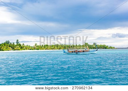 Wonderful Maldivian Boat Dhoni On Tropical Blue Sea, Taking Tourist To Snorkeling And Diving To See 
