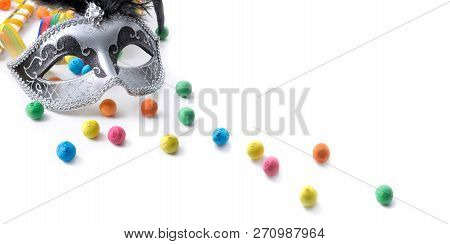 Carnival Mask Among Colorful Confetti On White Background